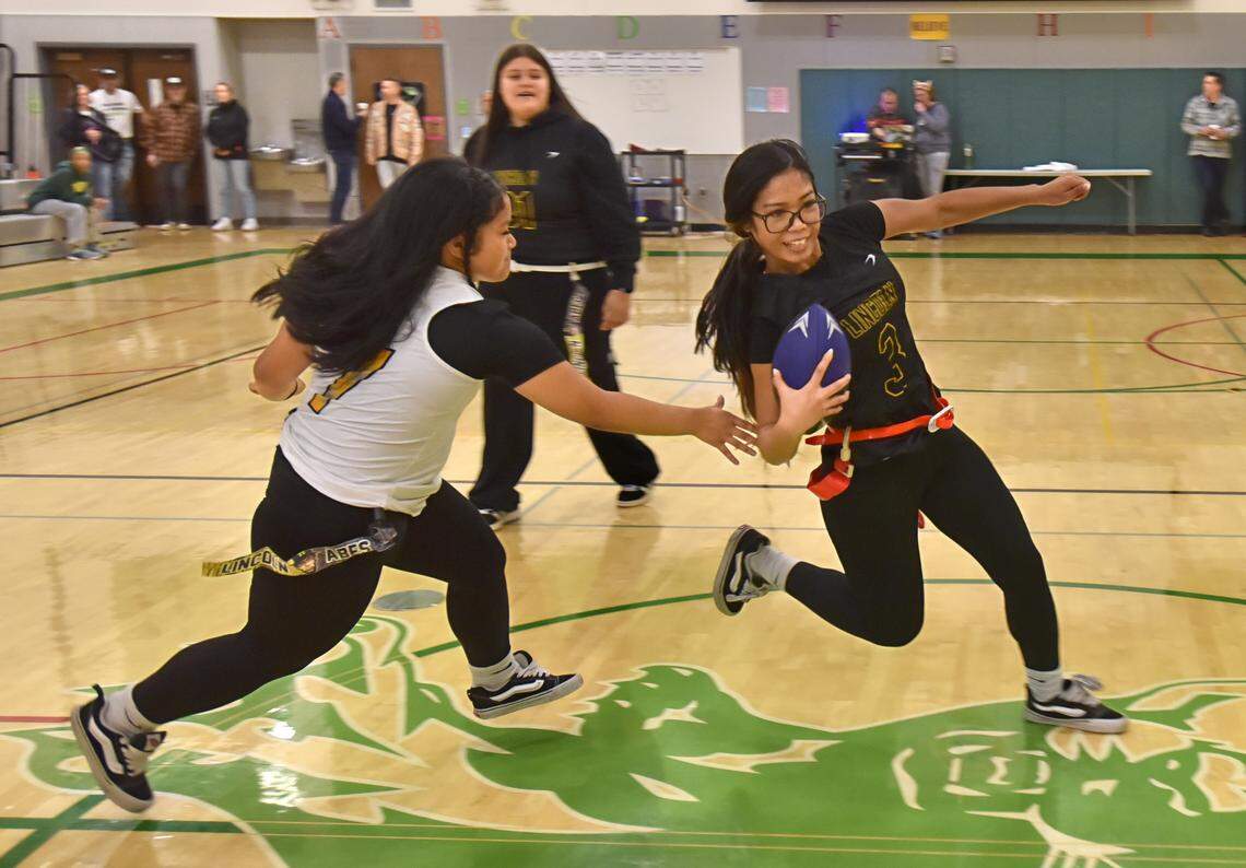 Lincoln High School students play flag football during a demonstration at an all-girls assembly at Stewart Middle School in October 2025.