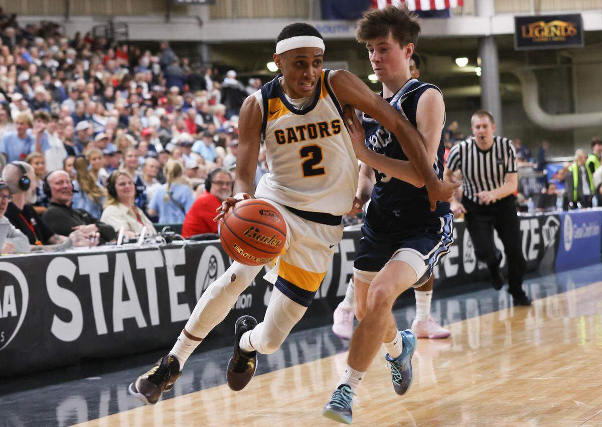 Annie Wright’s Jeremiah Harshman drives toward the hoop in the 1A boys state basketball championship game Saturday, March 8, 2025, at the Yakima Valley SunDome in Yakima, Wash.