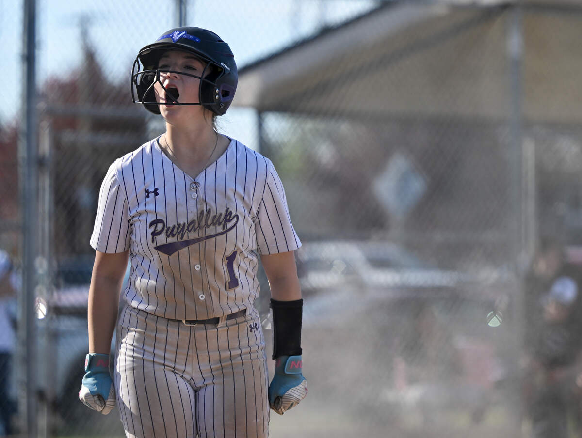 Puyallup’s Mack Hardesty (1) reacts to tying the game with a run against Emerald Ridge during the softball game at Puyallup High School, on Friday, April 18, 2025, in Puyallup, Wash.