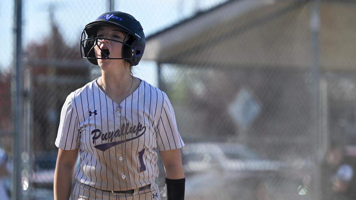 Puyallup’s Mack Hardesty (1) reacts to tying the game with a run against Emerald Ridge during the softball game at Puyallup High School, on Friday, April 18, 2025, in Puyallup, Wash.