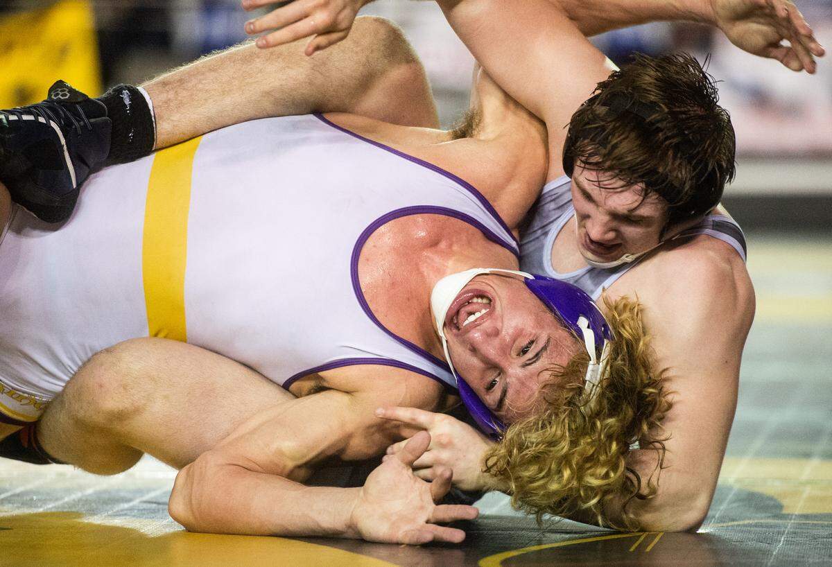 Puyallup’s Isaac Clark wrestles Chiawana’s Tyson Stover in the 4A 182 pound championship during day two of Mat Classic XXXII at the Tacoma Dome in Tacoma, Wash., on Saturday, Feb. 22, 2020.