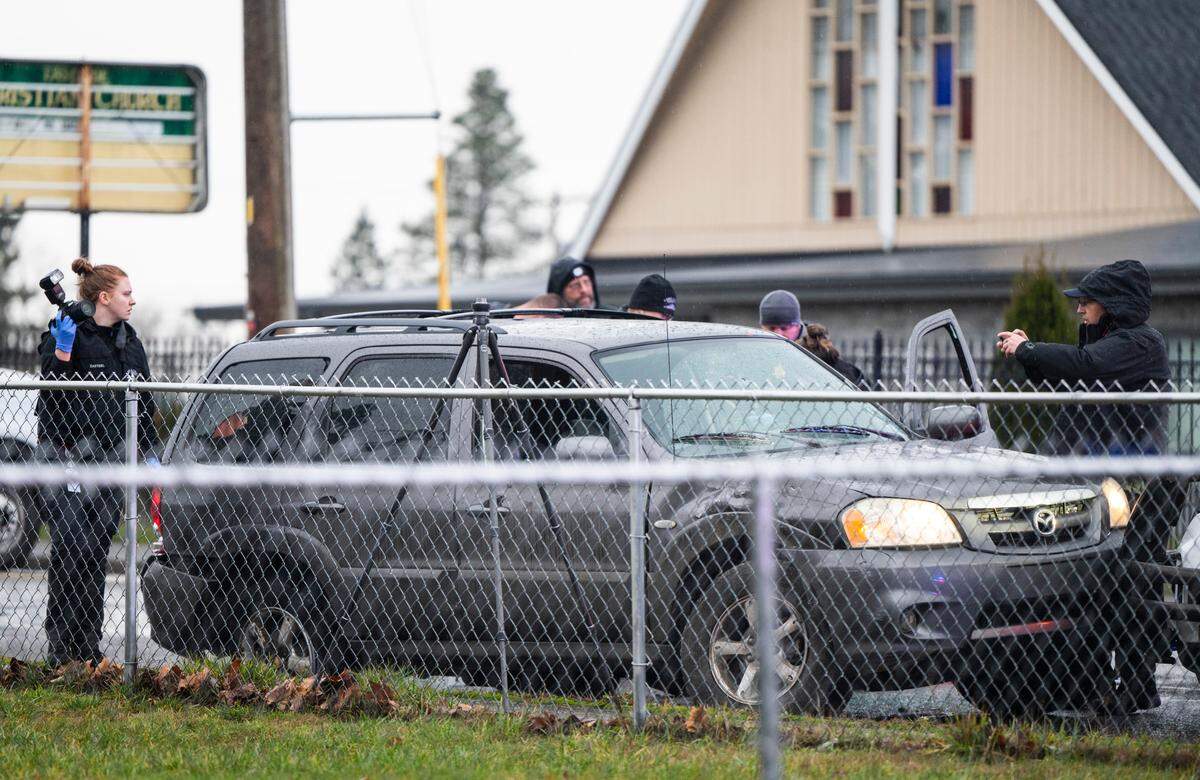 Crime scene technicians and the Pierce County Force Investigation Team investigate the scene where a person was shot and killed early Friday morning by a Tacoma Police Department officer after the person fled from police investigating them in a parked car near Pacific Avenue, and the shooting occurred at McKinley Avenue and East 57th Street in Tacoma, Wash. on Dec. 30, 2022.