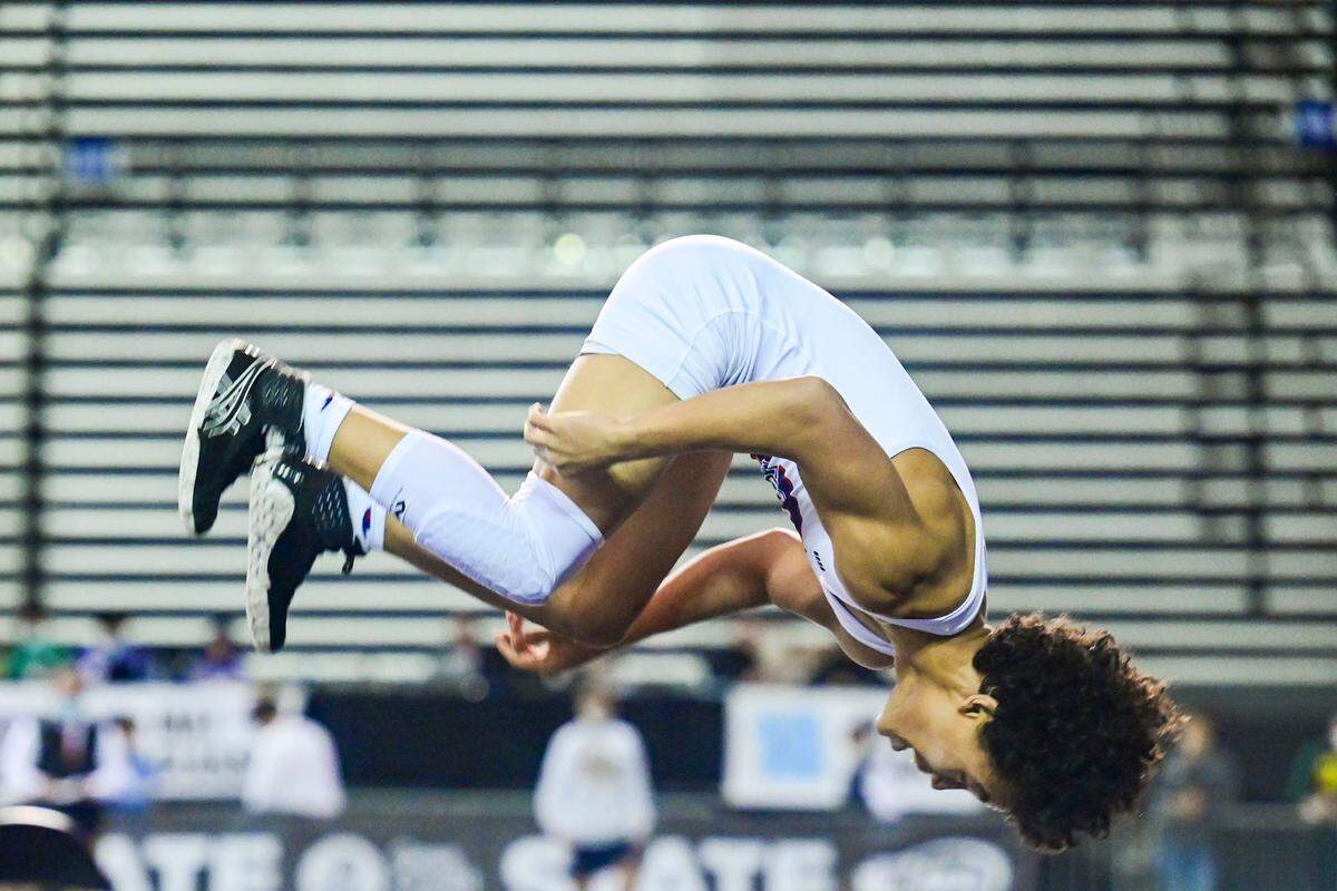 Silas’ Elijah Cater celebrates with a flip after beating University’s Tyler Walker 120-pound 3A championship match at Mat Classic XXXIII on Saturday, Feb. 19, 2022, at the Tacoma Dome in Tacoma, Wash. Cater pinned Walker in 2 minutes, 45 seconds.