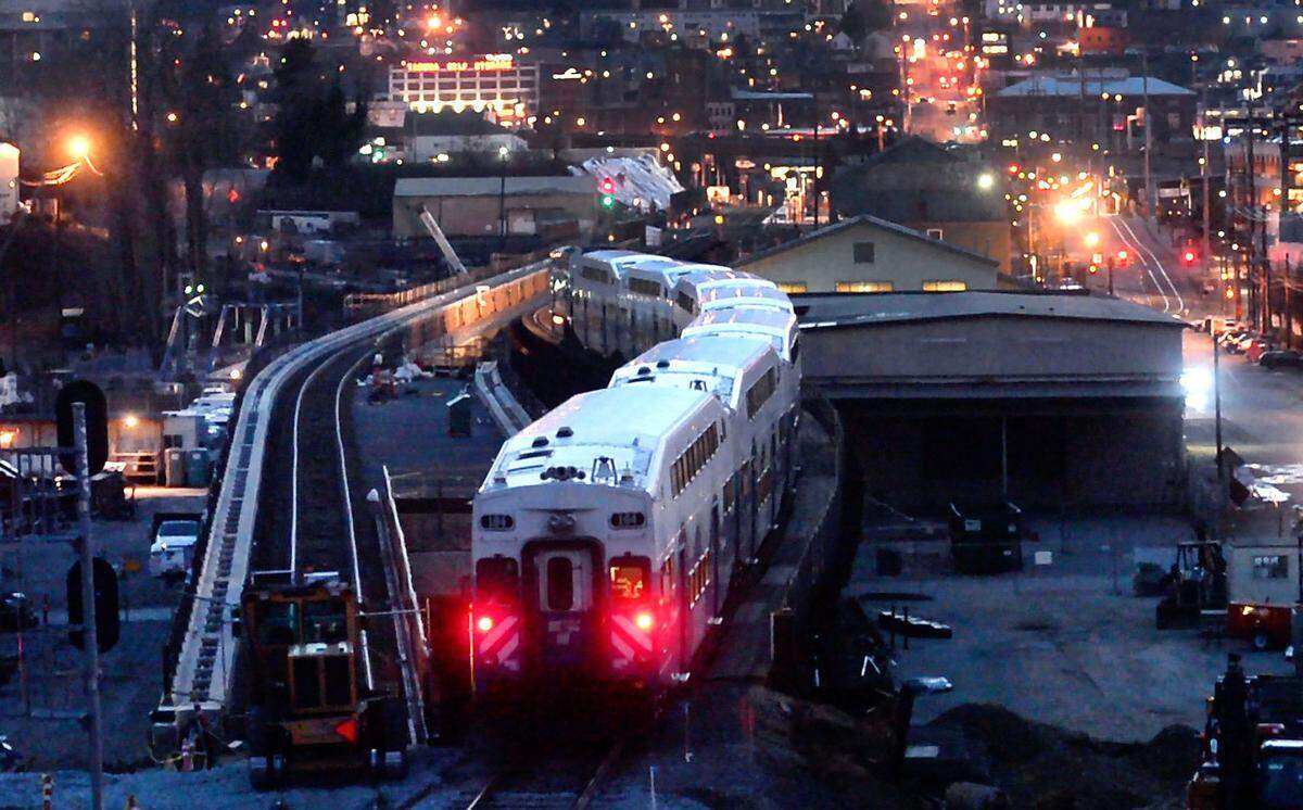 A southbound Sounder train navigates the old trestle adjacent to the new one under construction near Tacoma Dome station. The $161 million project to replace the trestle includes signal upgrades and road improvement and will expand the number of trains and reduce delays, says Sound Transit. Photo taken in Tacoma on Thursday, Feb. 2, 2017.