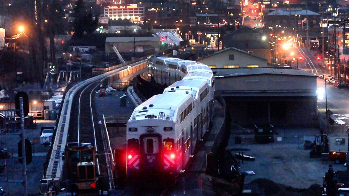 A southbound Sounder train navigates the old trestle adjacent to the new one under construction near Tacoma Dome station. The $161 million project to replace the trestle includes signal upgrades and road improvement and will expand the number of trains and reduce delays, says Sound Transit. Photo taken in Tacoma on Thursday, Feb. 2, 2017.