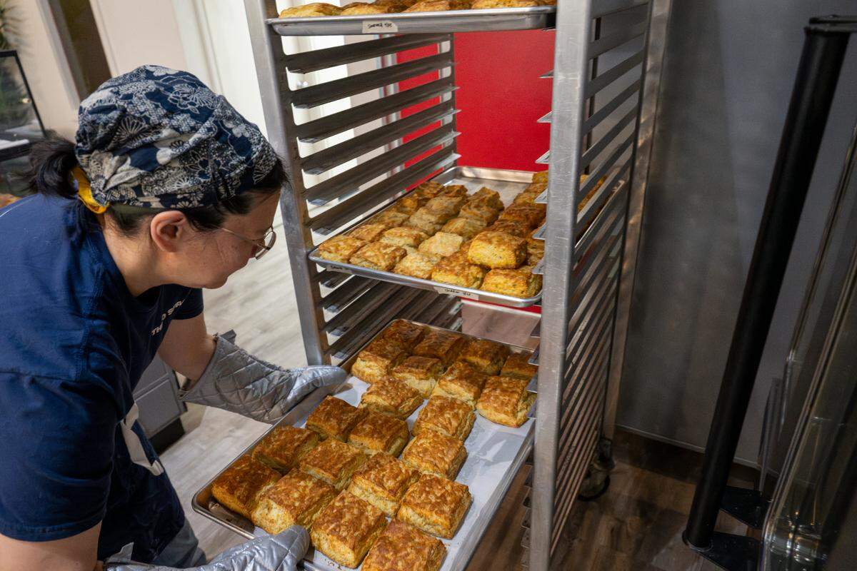 Sandy Tao prepares fresh biscuits each morning at Third Space in downtown Tacoma.