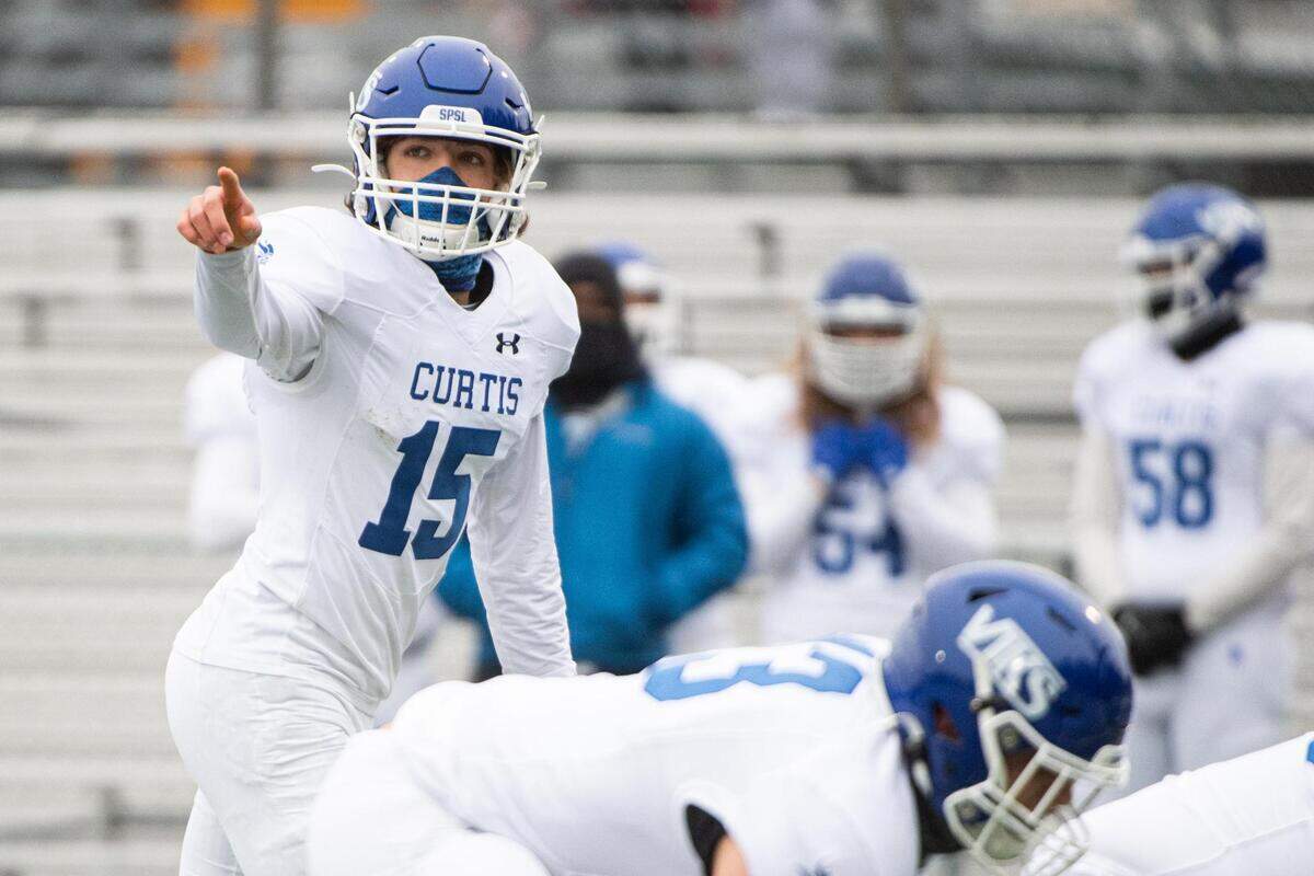 Curtis’ Rocco Coch (15) at the line during the game. Gig Harbor High School played Curtis High School in a jamboree football game at Roy Anderson Field in Purdy, Wash., on Friday, Feb. 12, 2021.
