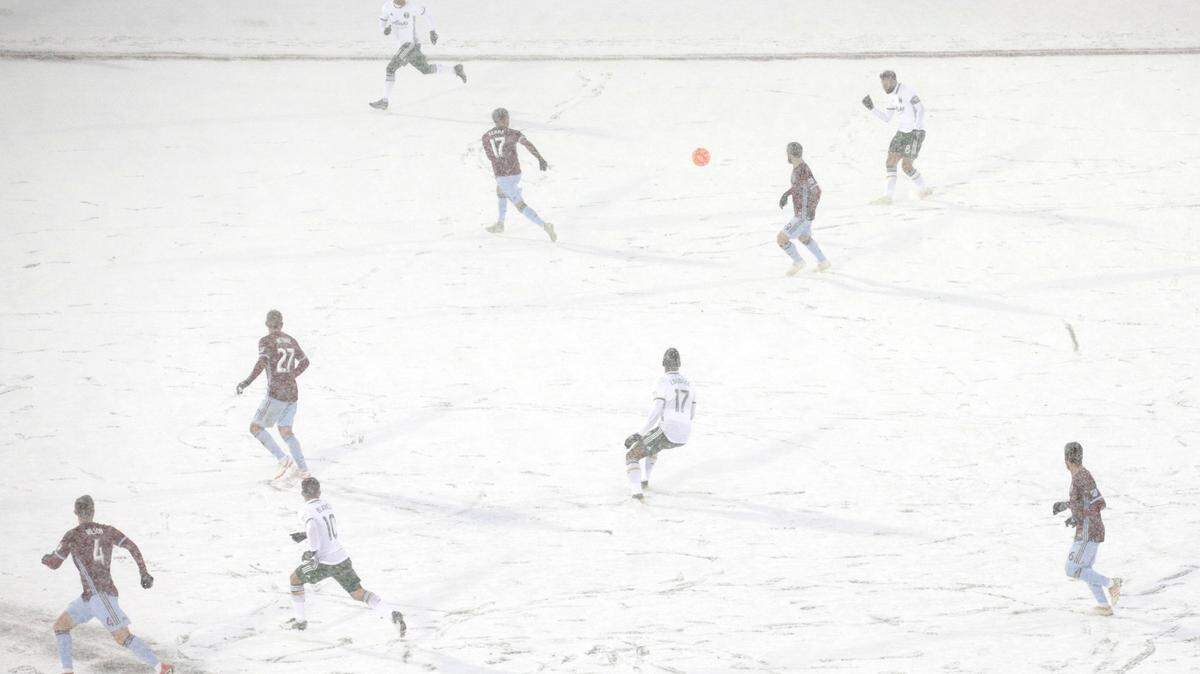 The Colorado Rapids play the Portland Timbers on a snow-covered pitch during the second half of an MLS soccer game Saturday, March. 2, 2019 in Commerce City, Colo. (AP Photo/Joe Mahoney)