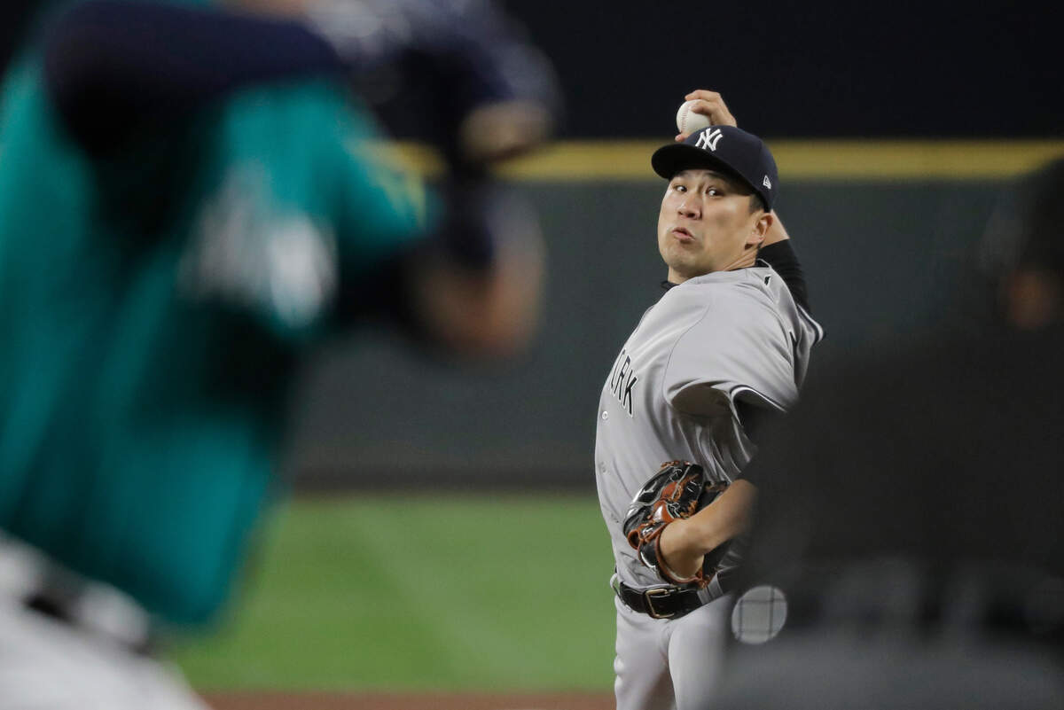 New York Yankees starting pitcher Masahiro Tanaka throws to a Seattle Mariners batter during the fifth inning of a baseball game Friday, Sept. 7, 2018, in Seattle. (AP Photo/Ted S. Warren)