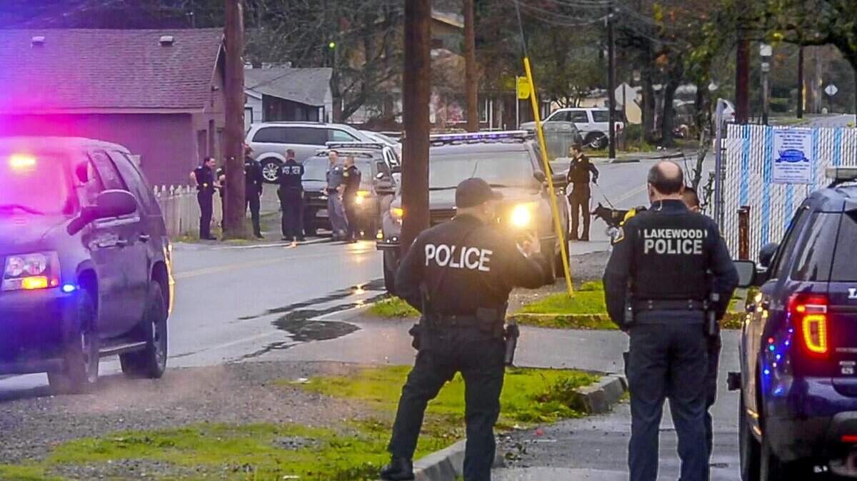 Lakewood Police, shown here after a 2016 suspect pursuit in Tilliicum, will no longer participate in the Pierce County Metro SWAT team. Instead, they’ll run their own team for high-risk warrants and contract with Pierce County Sheriff’s Department for higher-intensity SWAT incidents.