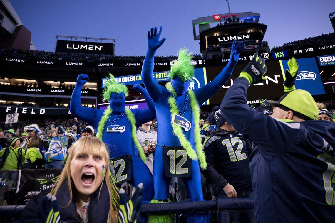 Fans react to Seattle Seahawks wide receiver Jaxon Smith-Njigba (11) touchdown against the Los Angeles Rams during the first quarter of the NFC Championship game at Lumen Field, on Sunday, Jan. 25, 2026, in Seattle.