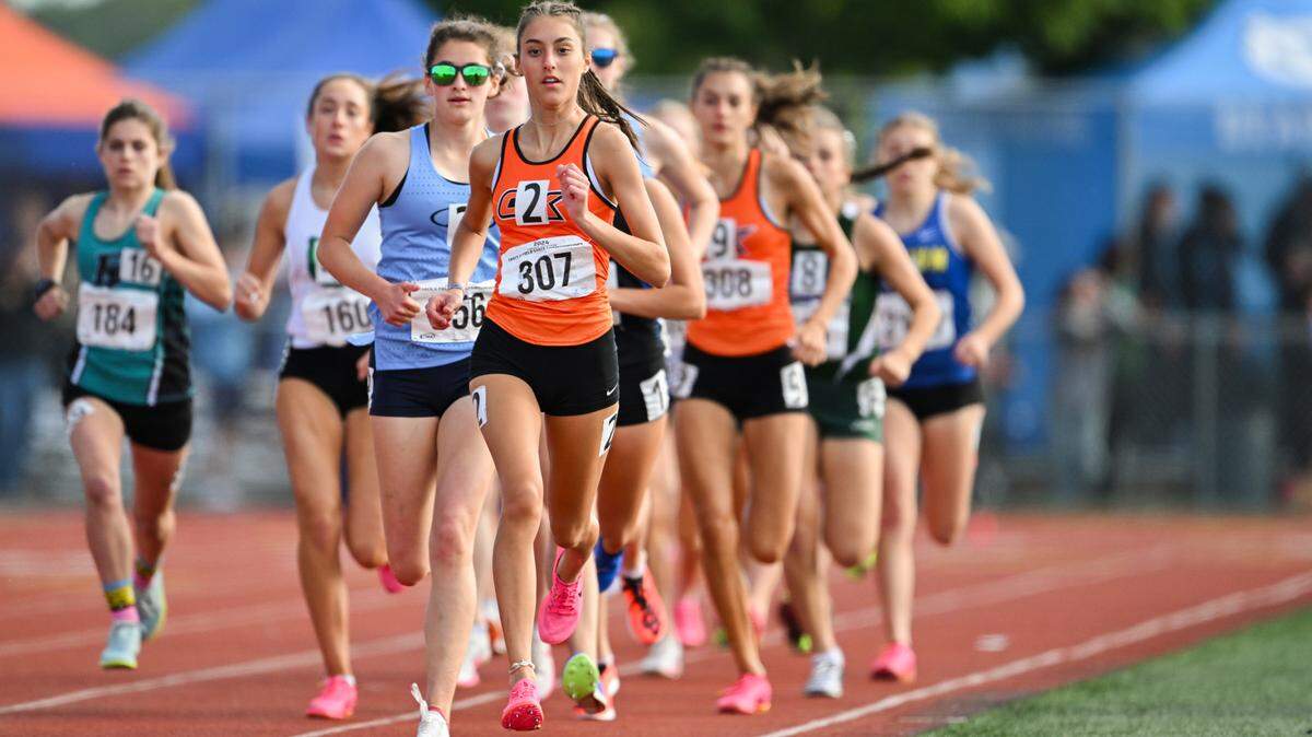 The 3A girls run down the back stretch in the 1600m final during of the Track and Field Championship in Tacoma in May 2024.