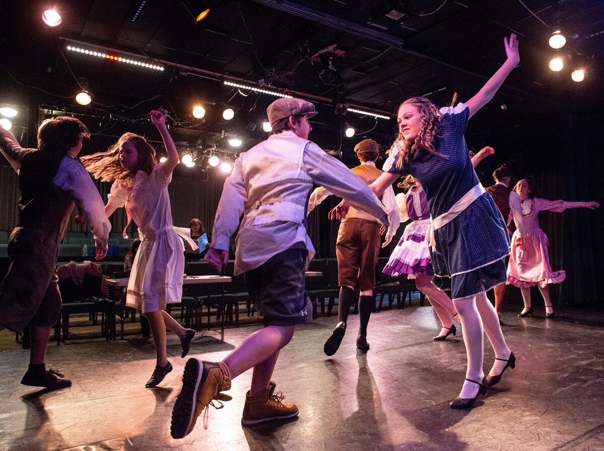 Actors dance on the stage during a rehearsal for The Music Man at Paradise Theater in Gig Harbor, Wash., on Thursday, May 31, 2018.