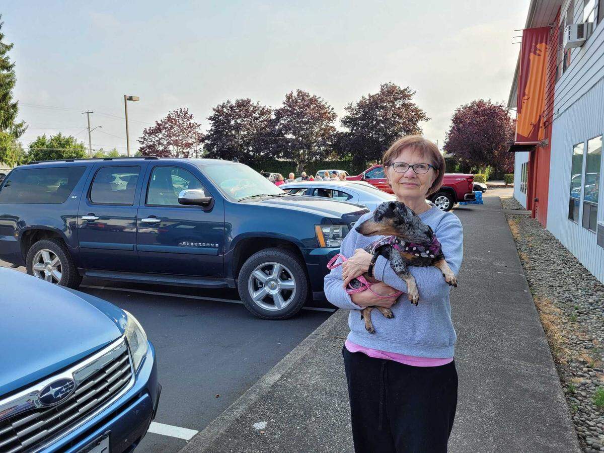 Susan Kletsch, her husband Roger, and Candy the mini-Dachshund headed to the Puyallup Nazarene Church parking lot early Saturday, which was set up as a shelter for families who had to evacuate a 1.1 mile radius of the city due to a large fire.