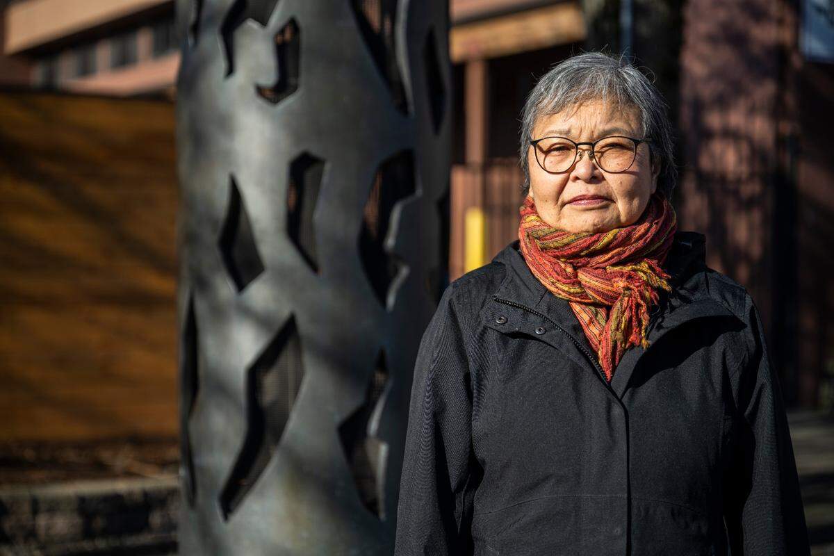 Mary Tanaka Abo, 82, poses for a portrait next to the statue, “Harmony,” that was created by Japanese American artist George Tsutakawa, to honor the people of Japanese ancestry that were incarcerated on the Washington State Fair grounds in Puyallup, Wash. during WWII, on Feb. 1, 2023. Abo was two-years-old when she and her family were forced to live at the camp after being removed from their home in Juneau, Alaska in 1942. The Puyallup Valley Japanese American Citizens League plans to build a remembrance gallery under the grandstands of the Washington State Fair to honor all of the Japanese American people who were incarcerated at the “Puyallup Assembly Center” or “Camp Harmony” during WWII.