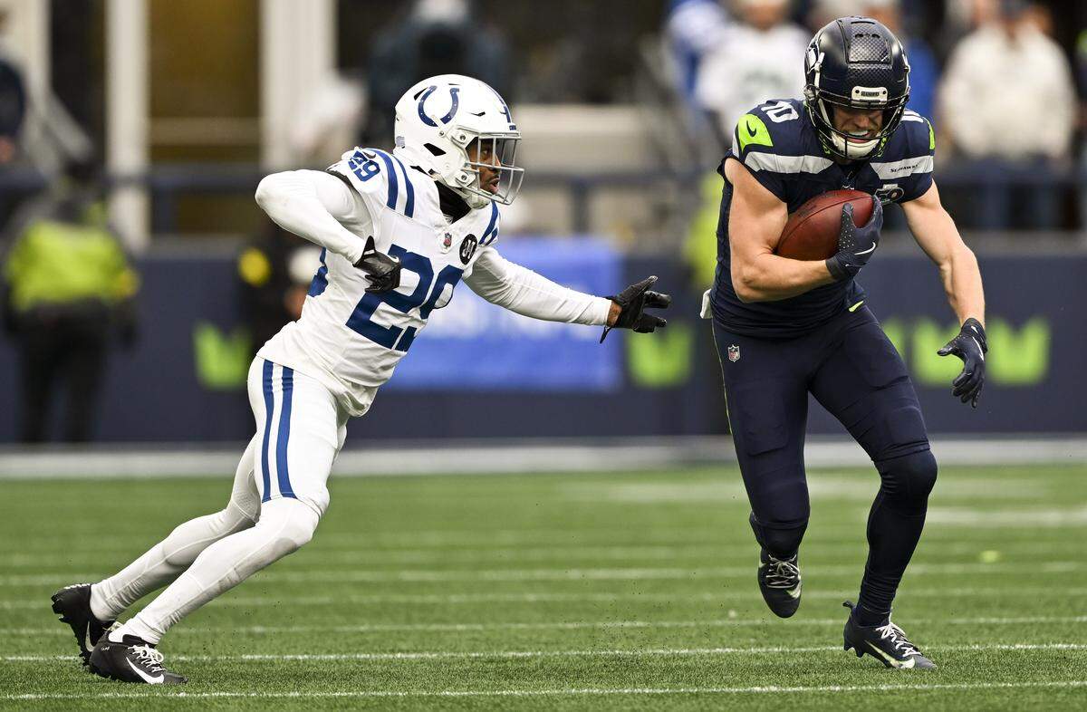 Seattle Seahawks wide receiver Cooper Kupp (10) makes a reception and protects the ball from Indianapolis Colts cornerback Mekhi Blackmon (29) during the second quarter of the game at Lumen Field, on Sunday, Dec. 14, 2025, in Seattle.