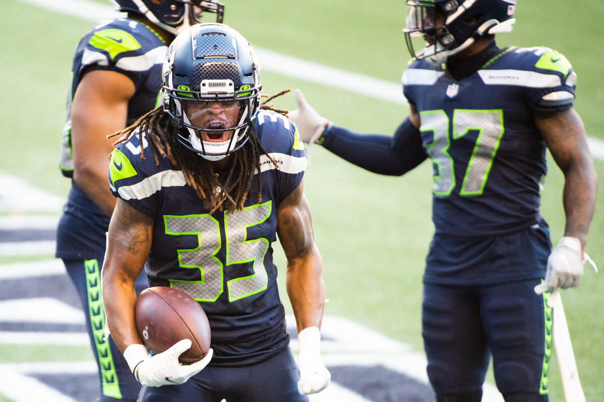 Seattle Seahawks Ryan Neal celebrates after making an interception in the end zone to seal the game. The Seattle Seahawks played the Dallas Cowboys in a NFL football game at CenturyLink Field in Seattle, Wash., on Sunday, Sept. 27, 2020.