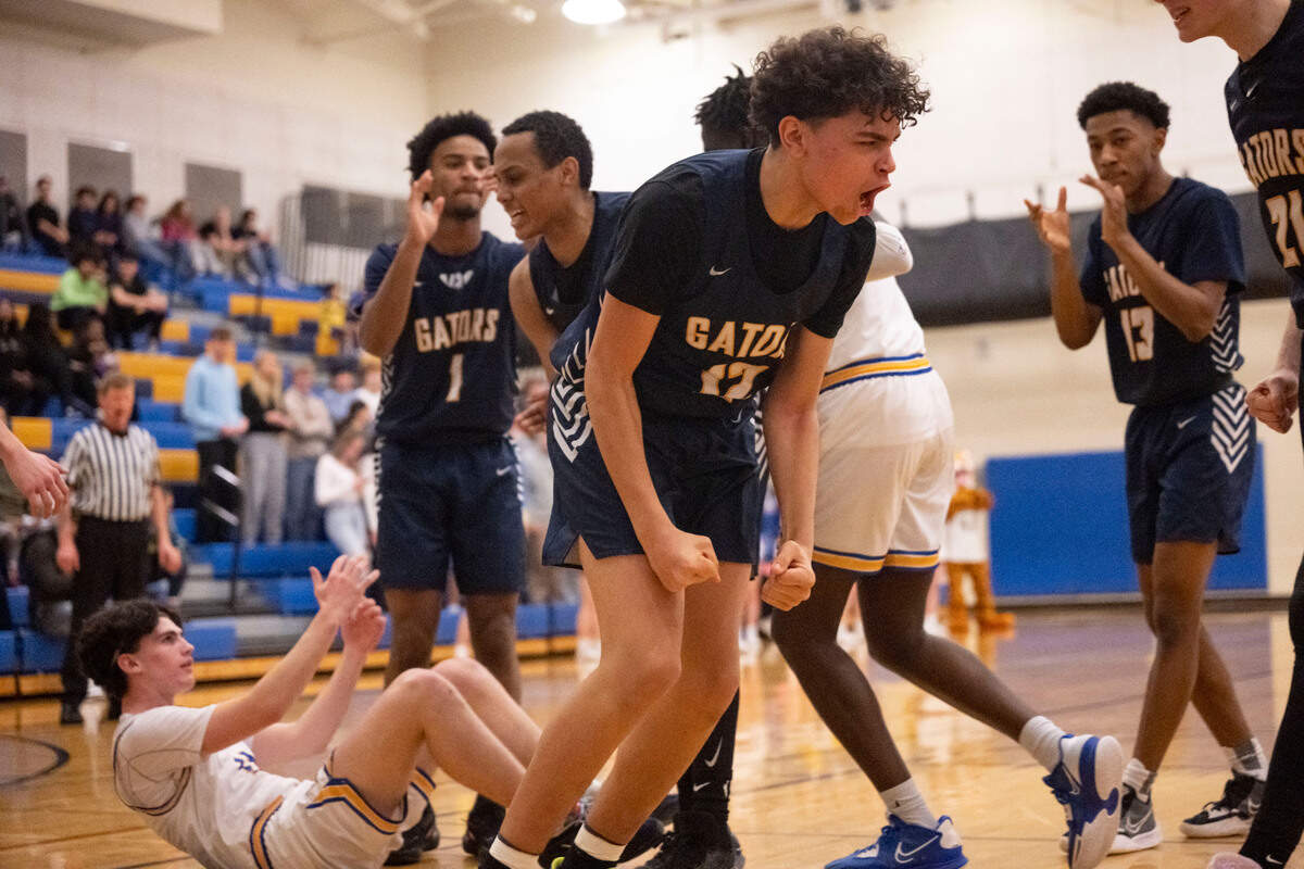 Annie Wright guard Amare Breedlove (12) celebrates after drawing a charge on Stadium guard Kellen O’Halloran (11) during the first quarter of a nonleague game on Wednesday, Jan. 25, 2023, at Stadium High School in Tacoma, Wash.
