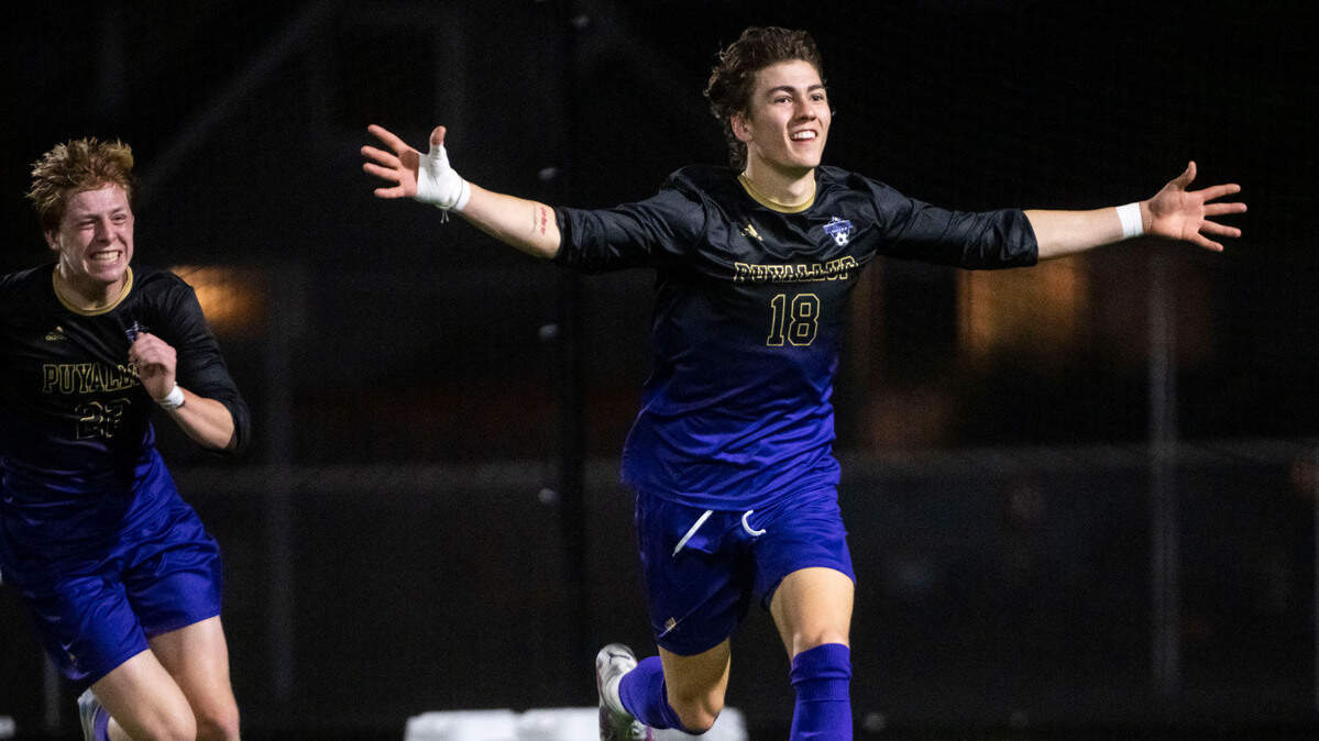 Puyallup midfielder Liam Stoner (18) celebrates after scoring a goal to tie the game against Curtis during the second half of a 4A Pierce County League boys varsity soccer game at Sparks Stadium in Puyallup, Wash. on May 1, 2023. The teams tied the game 2-2.