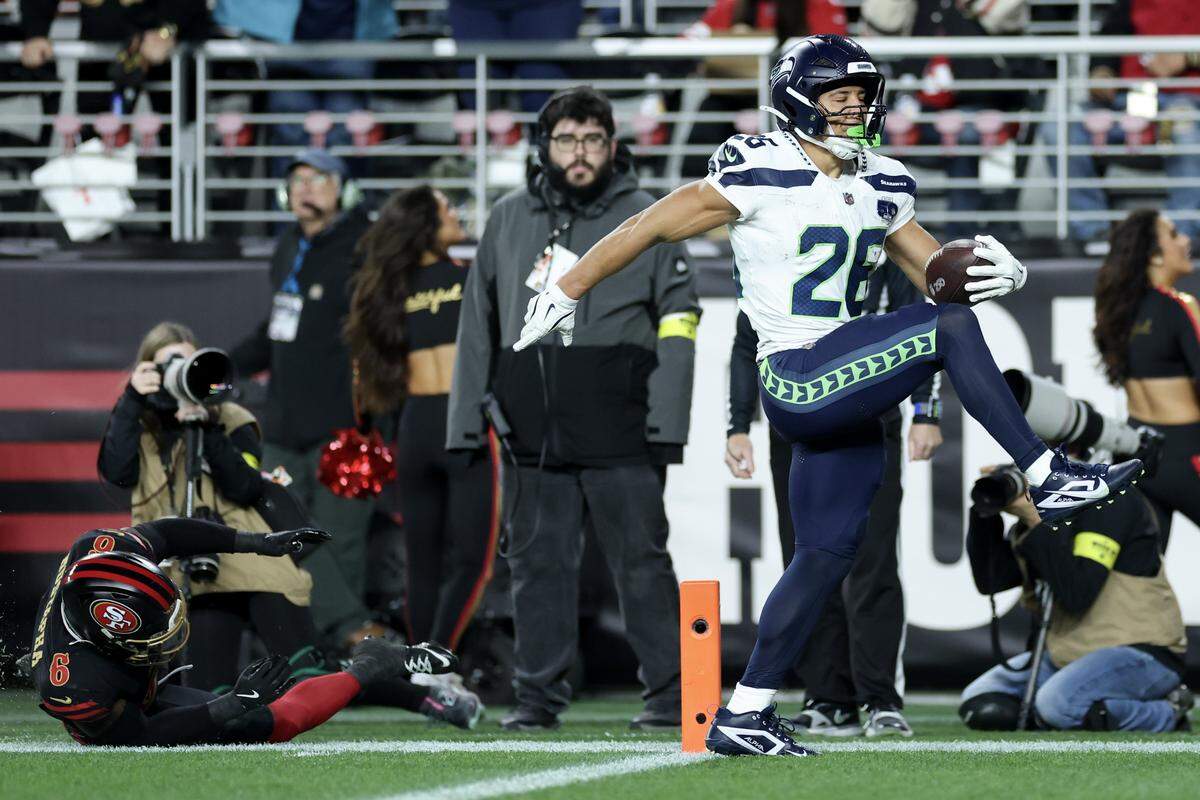 SANTA CLARA, CALIFORNIA - JANUARY 03: Zach Charbonnet #26 of the Seattle Seahawks scores a touchdown against the San Francisco 49ers during the first quarter of a game at Levi's Stadium on January 03, 2026 in Santa Clara, California. (Photo by Ezra Shaw/Getty Images)