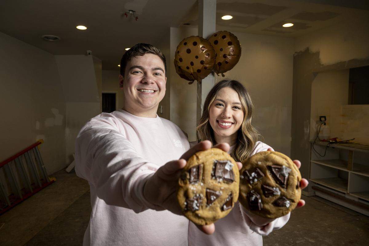 Jaxon Marquardt, left, and Adriana Shaffer, co-owners of Cove's Bakery, stand inside their future shop on Monday, Feb. 23, 2026, in downtown Tacoma, Wash.