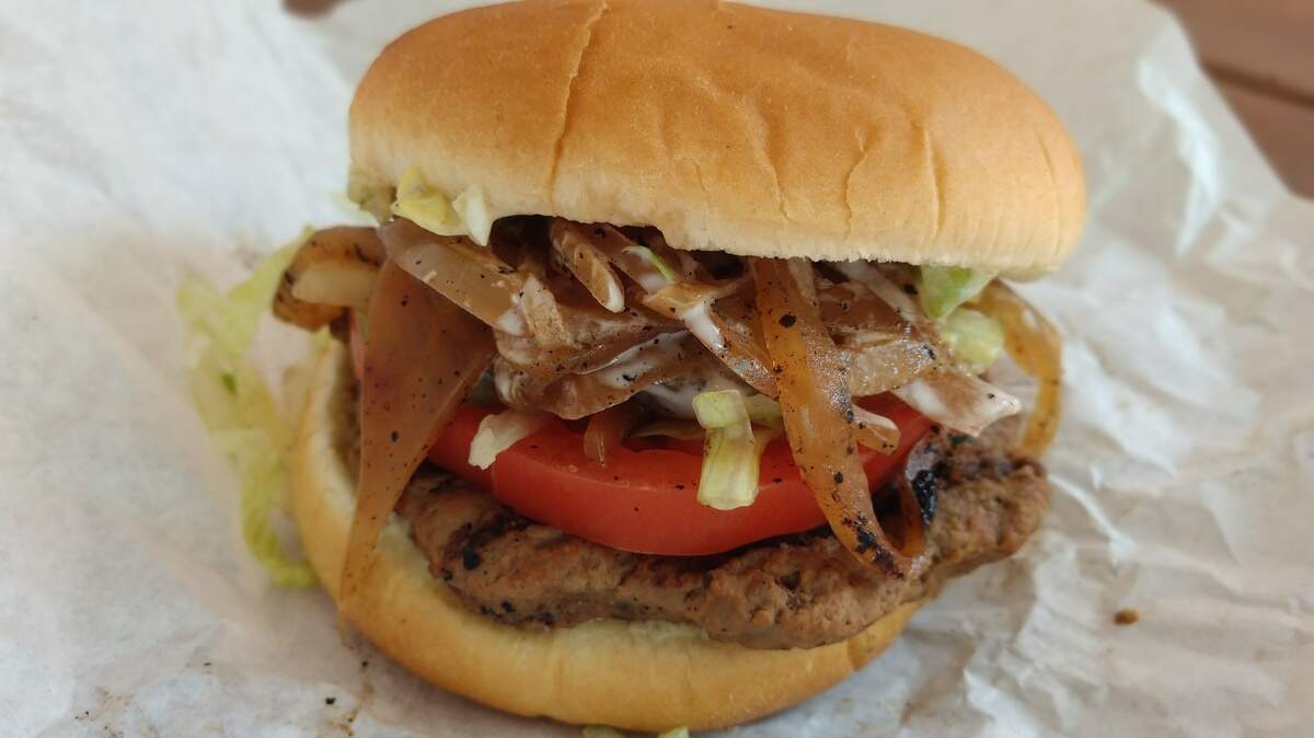 The hamburger with grilled onions from Bernie’s Burgers at the Washington State Fair.