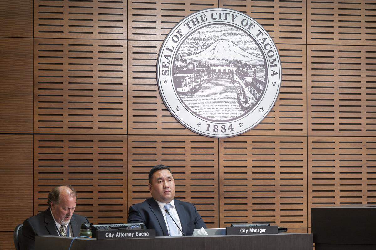 City Attorney Chris Bacha, left, and Hyun Kim, during his time as interim city amnager, take part in a Tacoma City Council meeting on Tuesday, June 24, 2025, in Tacoma.
