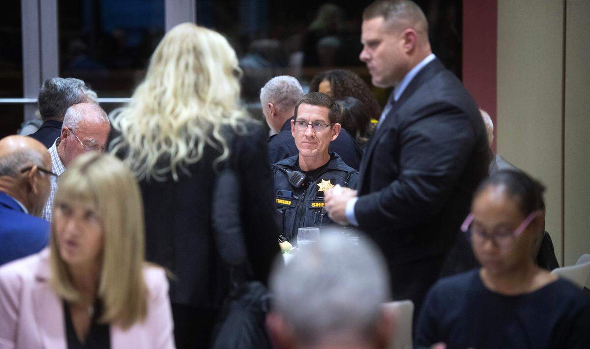 Edgewood police chief Jason Youngman (center) and other participants talk during a public safety forum at City Hall in University Place, Washington, on Wednesday, Nov. 1, 2023.