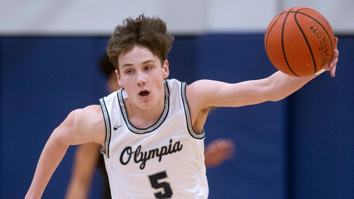 Olympia’s Kai Johnson breaks up court after making a steal during Saturday night’s SPSL 4A boys basketball game against Puyallup at Olympia High School on Jan. 4, 2020.