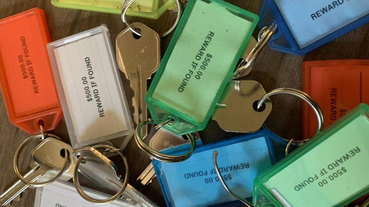A collection of keys contain a fob that states “$500 reward if found.” More than 40 of these have been discovered since March.
