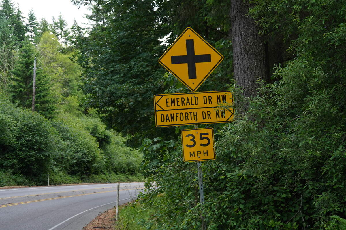 A sign shows an upcoming intersection on state Route 302 near the Wauna guardrail, Tuesday, June 9, 2026.