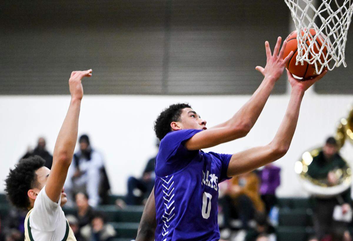 North Thurston’s Ray Adams (0) goes to the basket during the boys basketball game at Timberline High School, on Wednesday, Jan. 10, 2024, in Lacey, Washington.