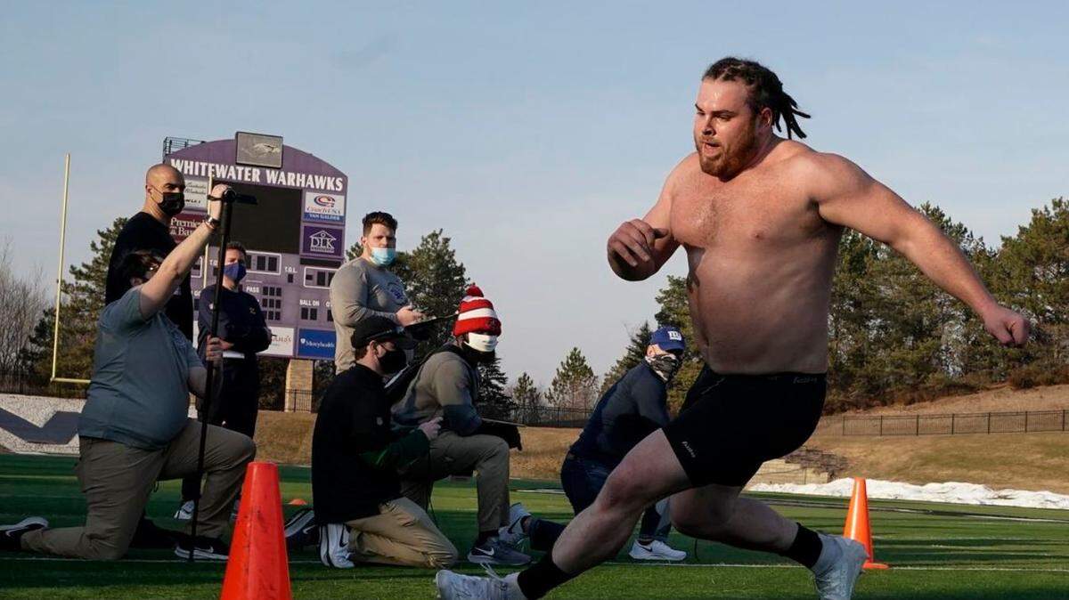 Wisconsin-Whitewater offensive lineman Quinn Meinerz runs at his school’s pro day in March in Whitewater, Wisconsin. The only Football Championship Subdivision teams hosting pro days this year were Central Arkansas, North Dakota State and South Dakota State. Division-III Wisconsin-Whitewater held one only because Meinerz was such a revelation at the Senior Bowl in January, and his team had its season canceled last fall because of the coronavirus pandemic.