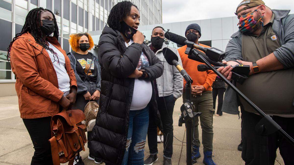 Monet Carter-Mixon, sister of Manuel Ellis, answers a reporter’s question following the arraignment of three Tacoma police officers at Pierce County Superior Court on Friday, May 28, 2021 in Tacoma, Washington.The officers were charged in the restraint death of Eliis, a Black man, who repeatedly told them he couldn’t breathe.