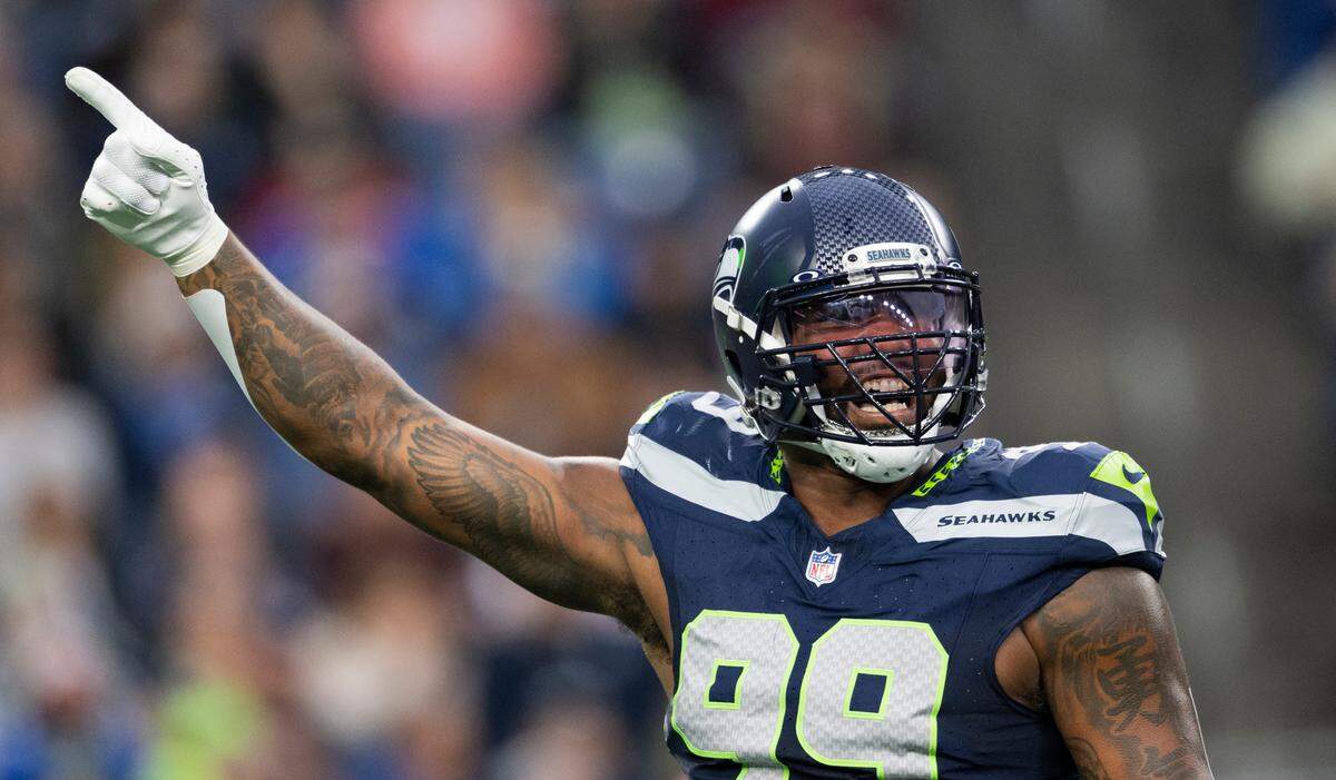 Seattle Seahawks defensive end Leonard Williams (99) reacts to a defensive stop against the Cleveland Browns during the first quarter of the preseason game at Lumen Field, on Saturday, Aug. 24, 2024 in Seattle, Wash.