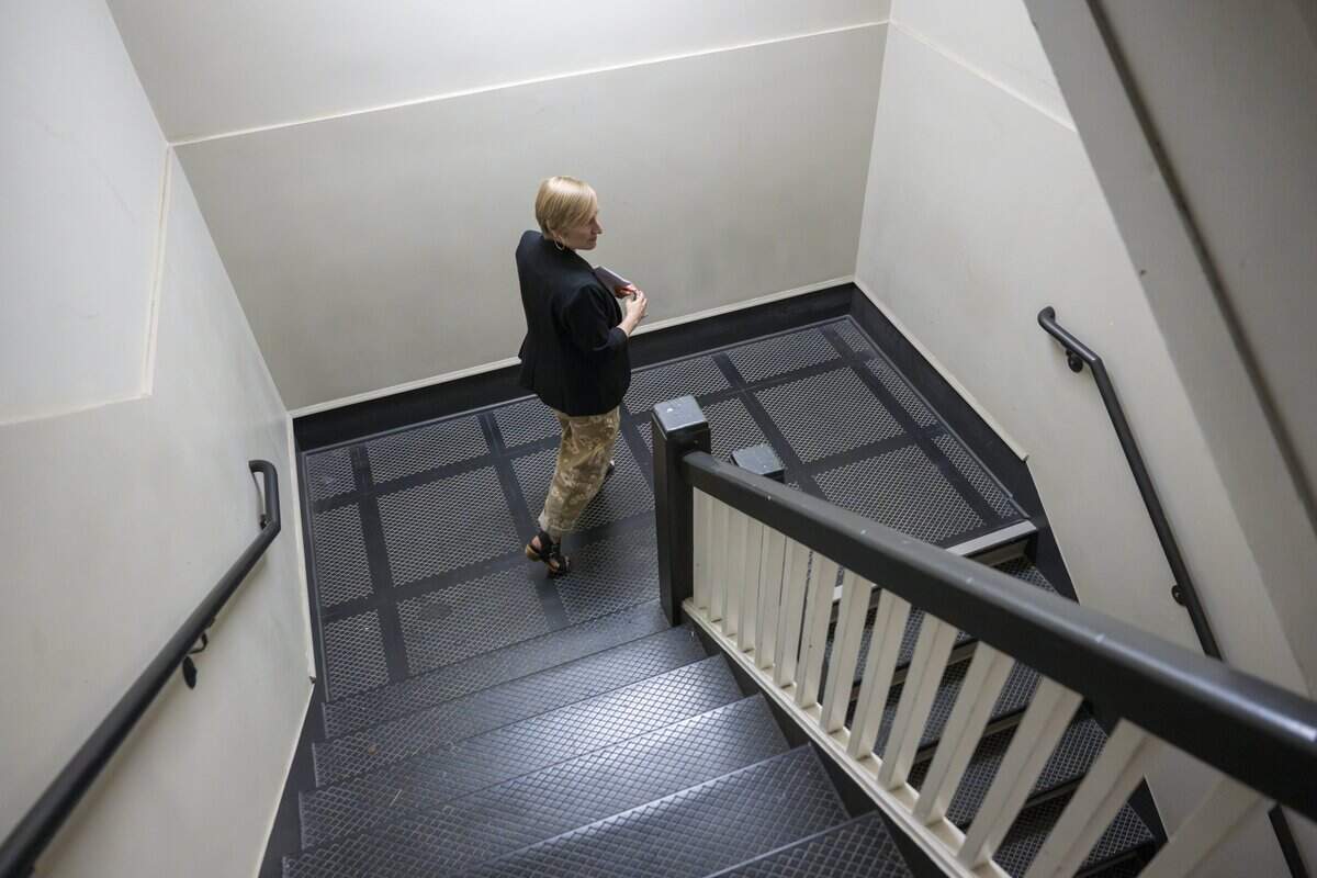 Katie Stricker, the new chief executive officer of Tacoma Arts Live, moves between floors of the Tacoma Armory on Wednesday, July 29, 2026, in Tacoma, Wash.