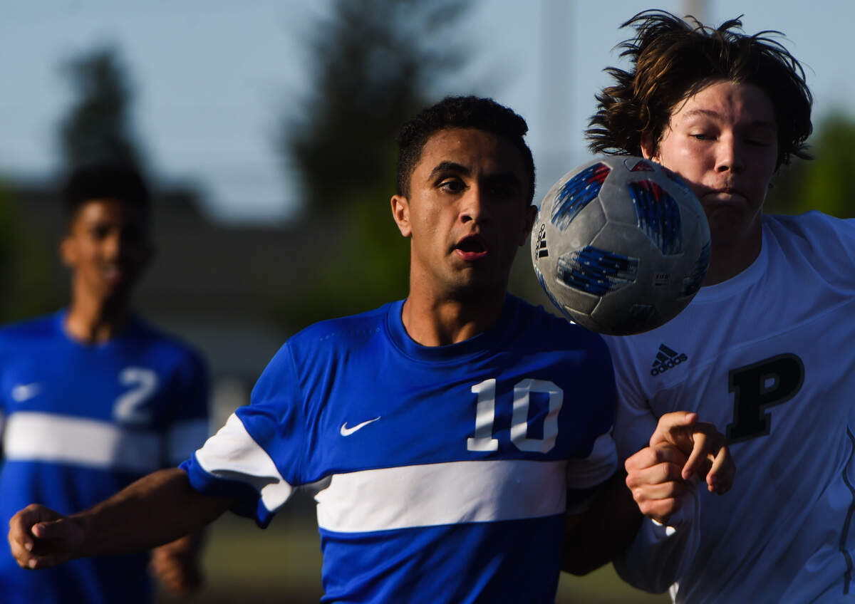 Stadium’s Martin Shehata and Peninsula’s Camron Watkins (5) fight for possession in the second half. Peninsula played Stadium in a soccer match at Mount Tahoma High School in Tacoma, Wash., on Thursday, May 9, 2019.