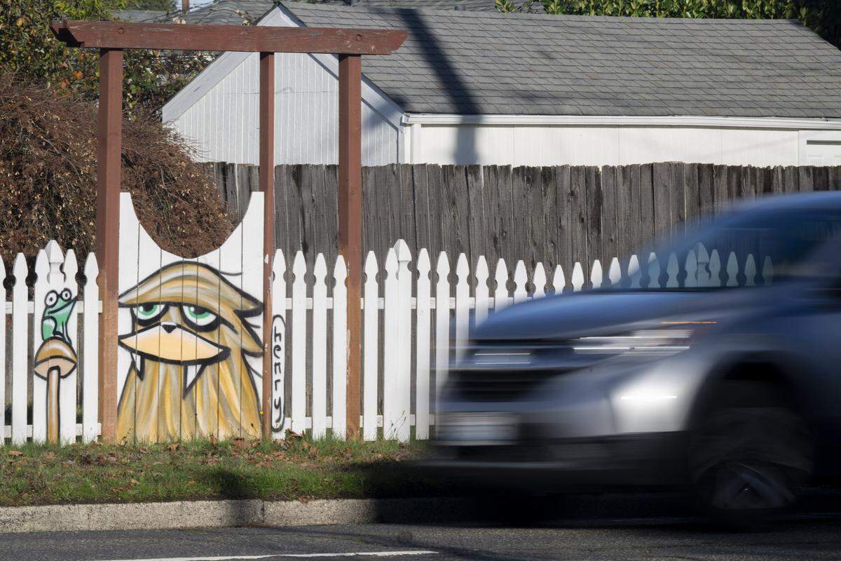 A Sasquatch mural by Ryan “Henry” Ward is visible along the fence line of a house along North 21st Street on Wednesday, Nov. 19, 2025, in Tacoma, Wash.