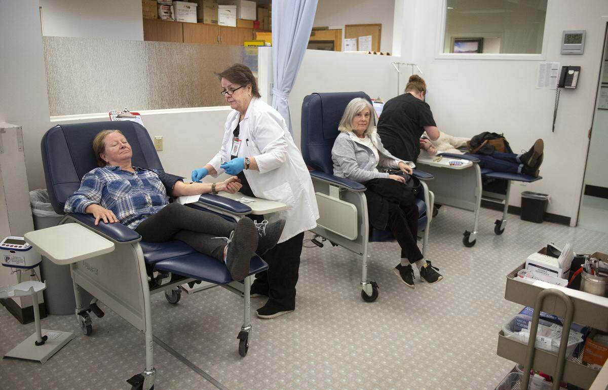 Staff assists donors at Cascade Regional Blood Services in Tacoma on Feb. 19, 2019.