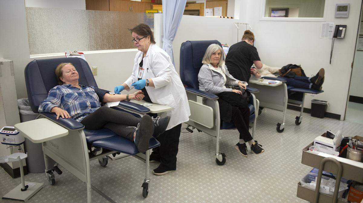 Staff assists donors at Cascade Regional Blood Services in Tacoma in February 2019. The nonprofit announced it was winding down operations at the end of February 2024.