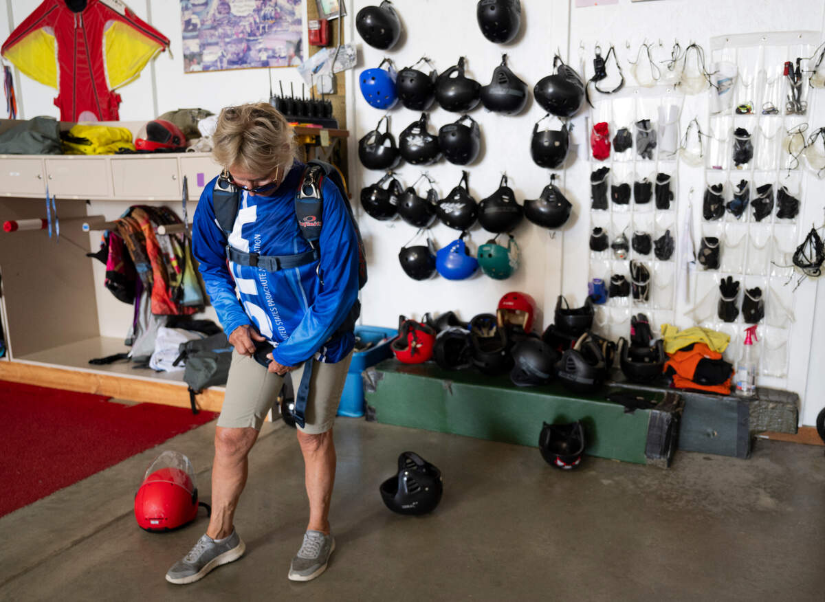 Jessie Farrington suits up to go for a jump at Skydive Kapowsin, on Monday, June 9, 2025, in Shelton, Washington.