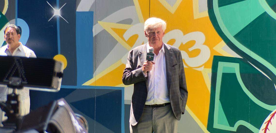 Mariners chairman and managing partner John Stanton speaking July 5, 2023, at a press event in the Pioneer Square section of Seattle with Mayor Bruce Harrell (far left) for the events surrounding the city hosting the 93rd Major League All-Star Game July 11, 2023, at T-Mobile Park.