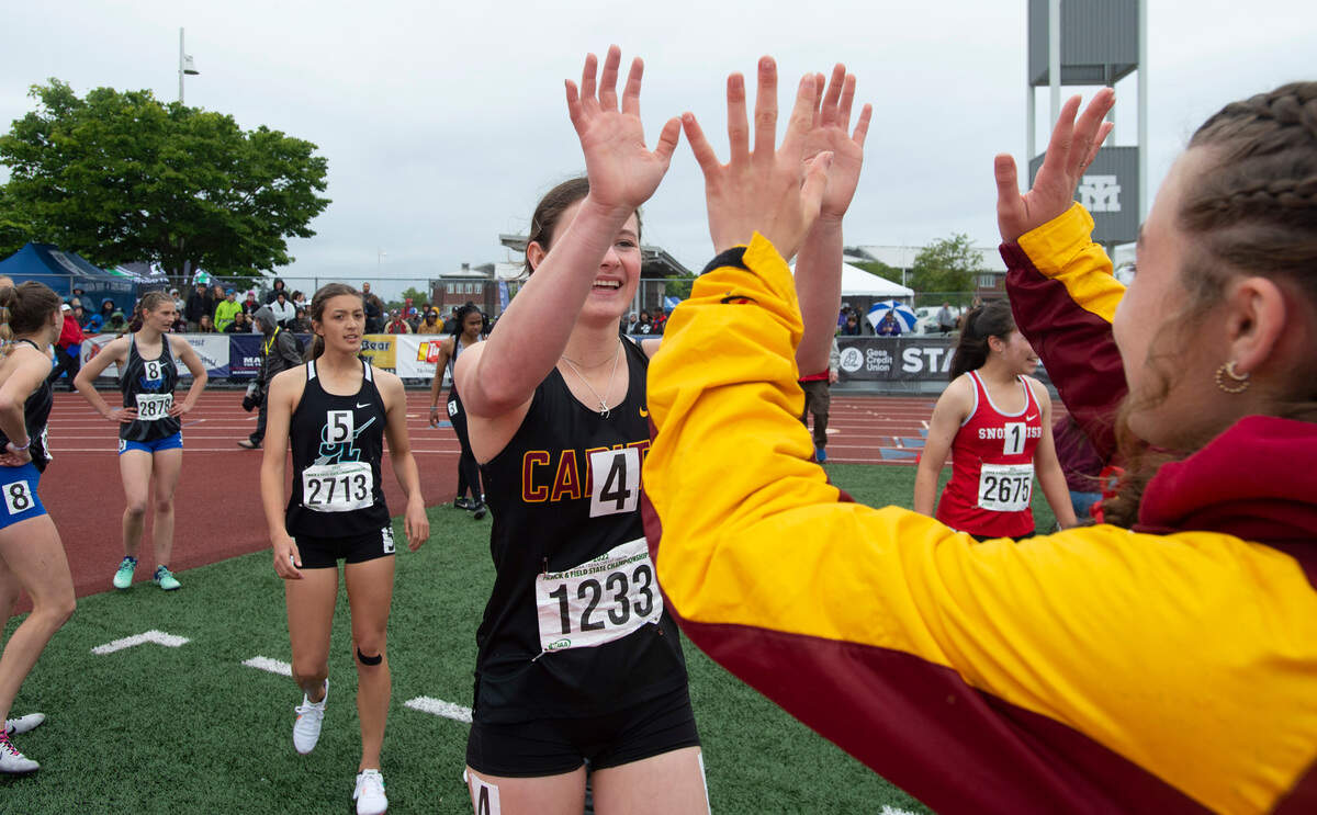 Capital’s Hana Moll celebrates after anchoring the Cougars’ 400-meter relay team to the 3A state championship during the final day of the WIAA State Track and Field Championships at Mount Tahoma High School in Tacoma, Washington on Saturday, May 28, 2022.
