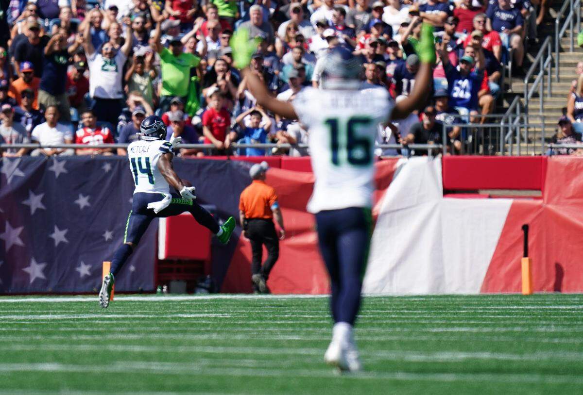 Sep 15, 2024; Foxborough, Massachusetts, USA; Seattle Seahawks wide receiver DK Metcalf (14) scores a touchdown against the New England Patriots in the first quarter at Gillette Stadium. Mandatory Credit: David Butler II-Imagn Images