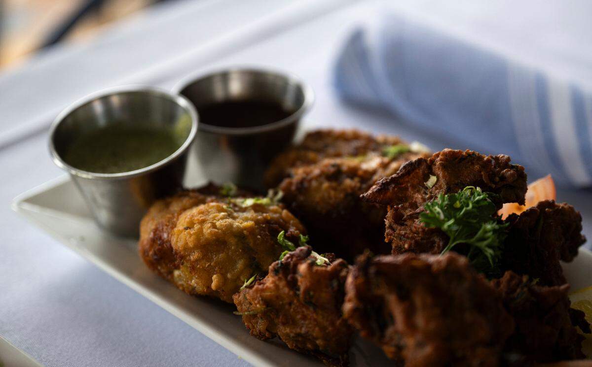 Aloo cutlets and vegetable pakora, served with tamarind and mint chutneys, are among the new Indian options at Johnny’s Dock. Gary Purewal also operates Indian-focused restaurants in Seattle and Oak Harbor.