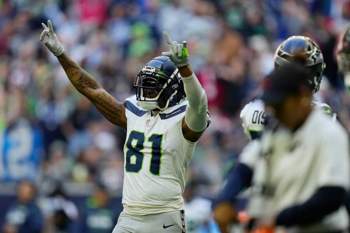 Seattle Seahawks tight end Gerald Everett (81) celebrates after scoring a touchdown against the Houston Texans during the second half of an NFL football game, Sunday, Dec. 12, 2021, in Houston. (AP Photo/Eric Christian Smith)