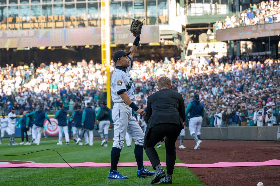 After throwing out the ceremonial first pitch, former Seattle Mariner Ichiro Suzuki acknowledges the standing ovation from the crowd prior to the start of the home opener at T-Mobile Park in Seattle on Friday, April 15, 2022.