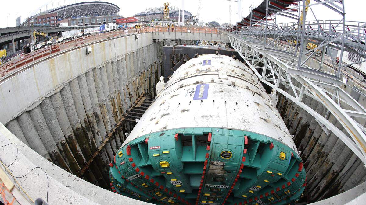 In this 2013 photo made with a fish-eye wide-angle lens, "Bertha," the massive tunnel-boring machine, is shown ready to begin drilling the tunnel to replace the Alaskan Way viaduct, a double deck highway along the downtown Seattle waterfront.