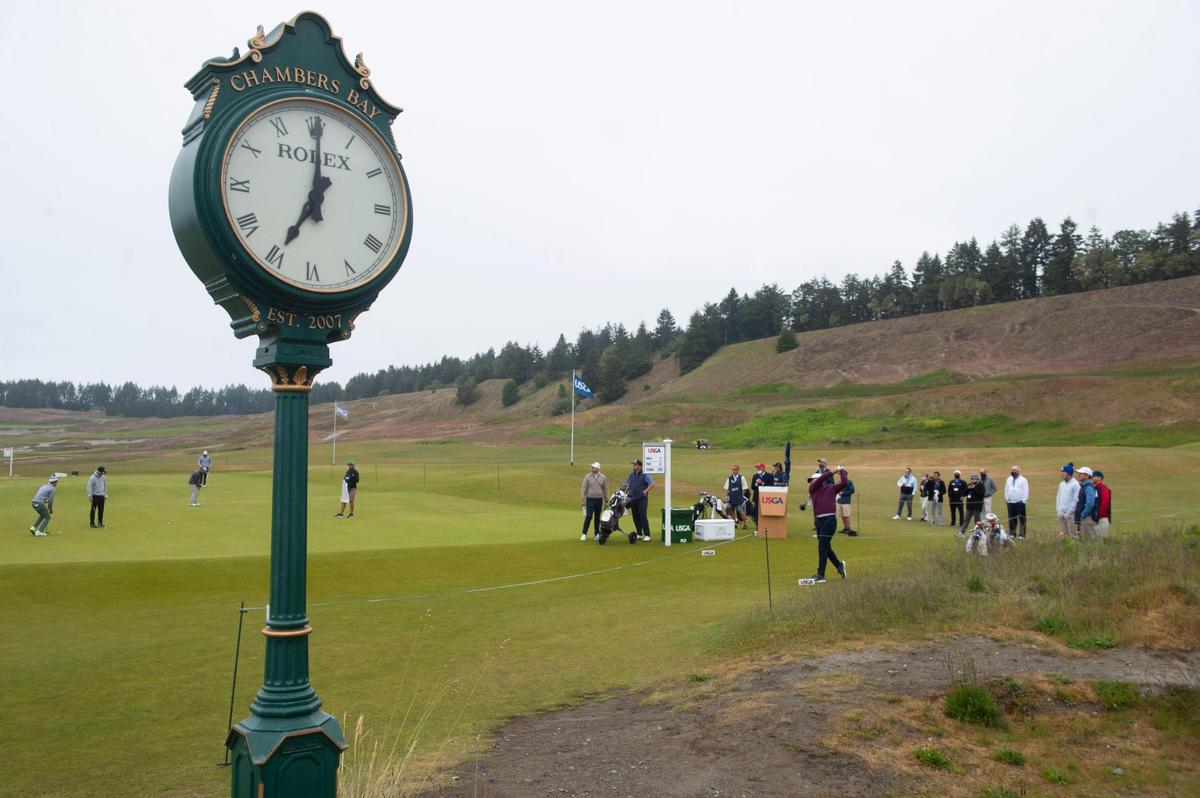 Bright and early at 7 a.m., the first group tees off in the first round of the U.S. Amateur Four-Ball Championship at Chambers Bay in University Place, Wash. on Saturday, May 22, 2021.