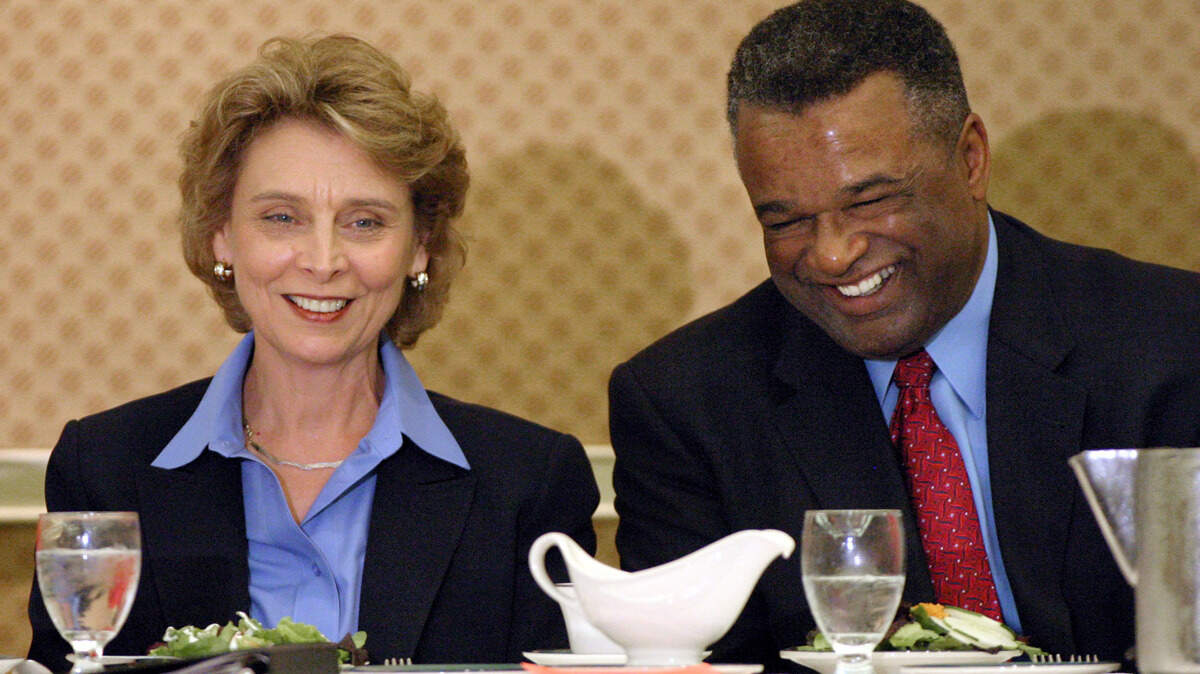 Democratic gubernatorial hopefuls Chris Gregoire, left, and Ron Sims, smile during a light moment before speaking at the Tacoma City Club luncheon on July 21, 2004. The Tacoma institution is at a crossroads after its executive director resigned.